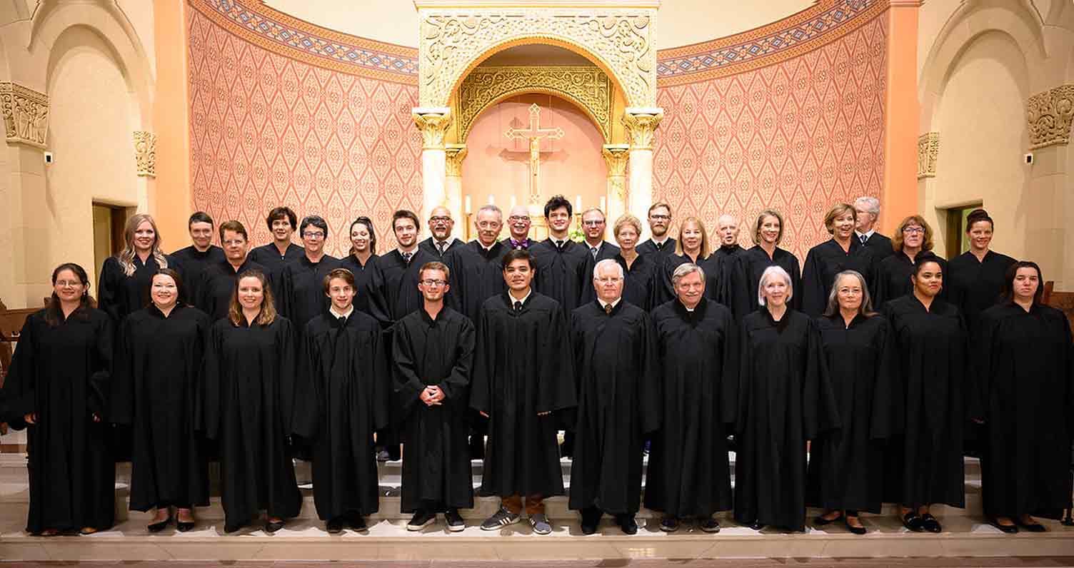 Choir standing in front of altar