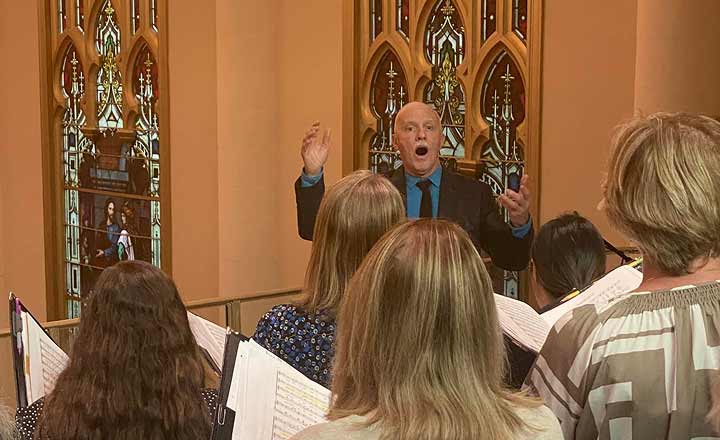 Donald Kendrick directing choir practice